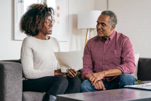 istock Assisting with taxes 1053987378
