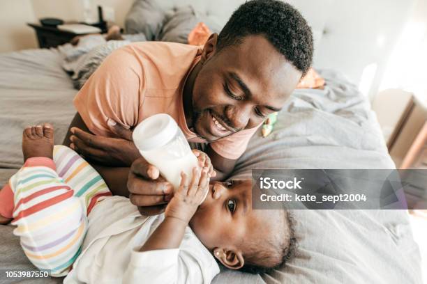 Best Babysitter Stock Photo - Download Image Now - Baby - Human Age, Father, Feeding