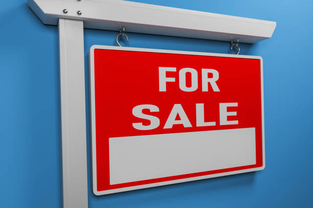 istock Real estate sign on blue- Stock image 1053994100
