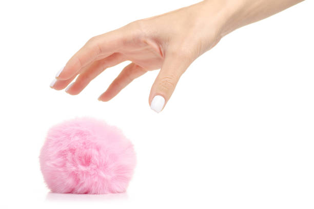 istock Fur ball pink in hand 1053994564
