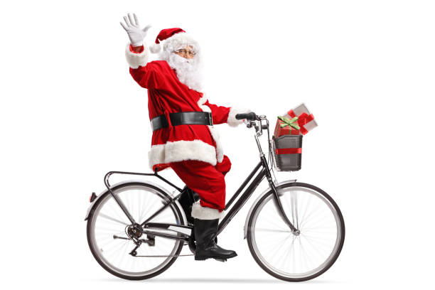 santa claus riding a bicycle and waving - bicycle isolated basket red imagens e fotografias de stock