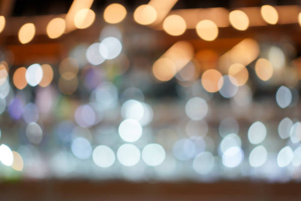 istock Blurry and bokeh background with the white, silver, platinum, gold color theme. 1053997052
