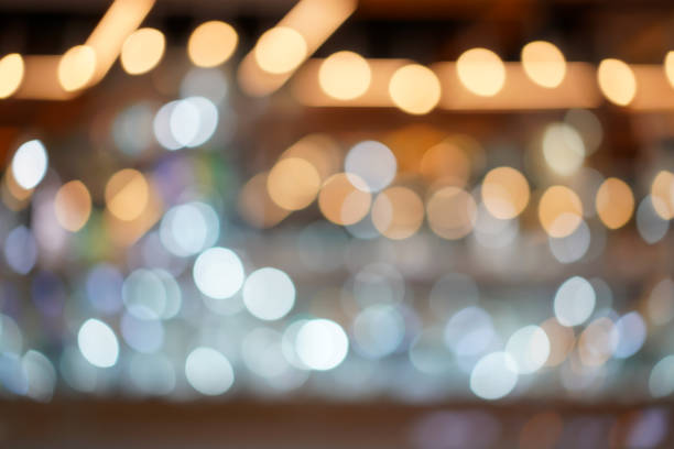 istock Blurry and bokeh background with the white, silver, platinum, gold color theme. 1053998024