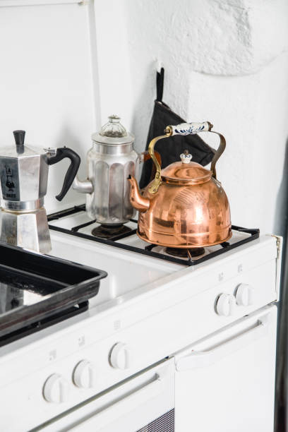istock French copper teapot on a white stove 1054000904