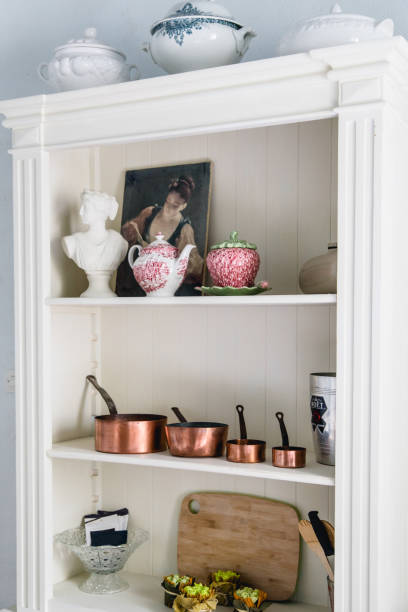 istock Copper kitchen saucepans standing at the counter 1054000908
