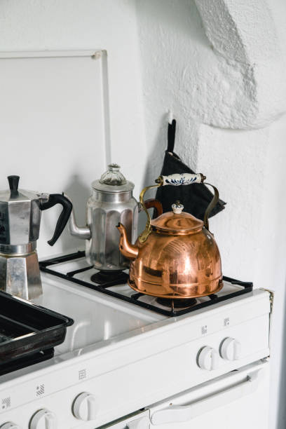 istock French copper teapot on a white stove 1054000914