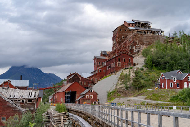 Historic abandoned Kennecott Mine in Wrangell-St. Elias National Park in Alaska during an overcast summer day Historic abandoned Kennecott Mine in Wrangell-St. Elias National Park in Alaska during an overcast summer day prince william sound photos stock pictures, royalty-free photos & images
