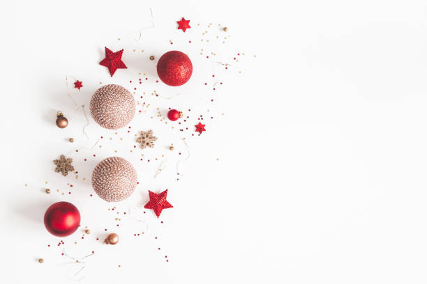 istock Christmas composition. Christmas red and golden decorations on white background. Flat lay, top view, copy space 1054001530
