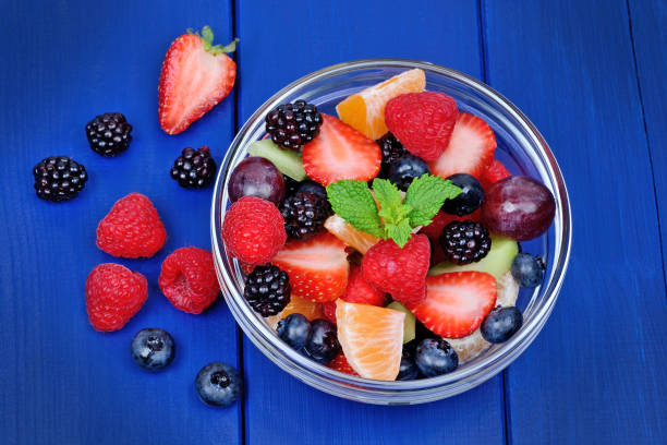 istock Fresh fruit salad in a bowl on table 1054002124