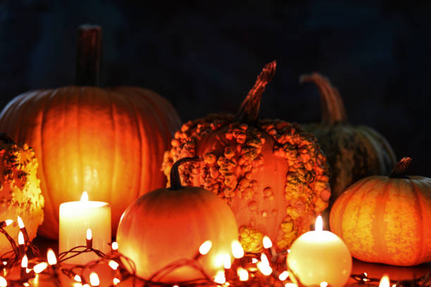 istock Halloween, autumn scene with pumpkins and candles. 1054003252