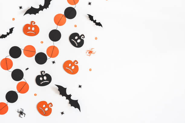istock Halloween decorations on white background. Halloween concept. Flat lay, top view, copy space 1054003356