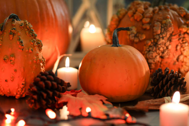 istock Halloween, autumn scene with pumpkins and candles. 1054003388