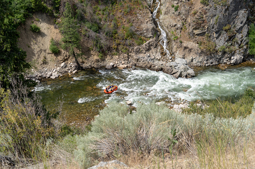White water rafters go down a Class 3 rapids along the Payette River during summertime in Garden Valley Idaho