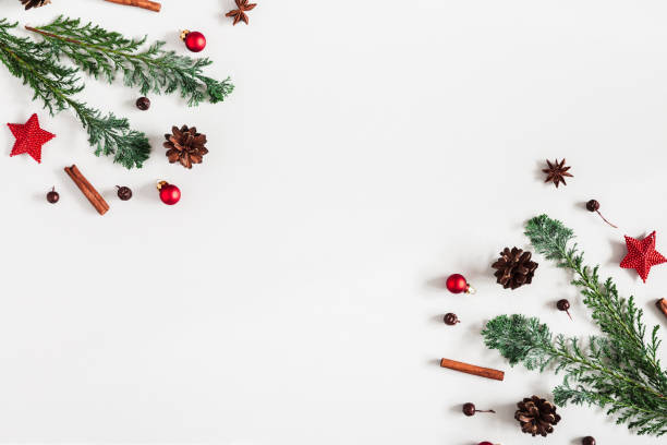 istock Christmas composition. Christmas decorations. fir tree branches. pine cones on pastel gray background. Flat lay, top view, copy space 1054003914