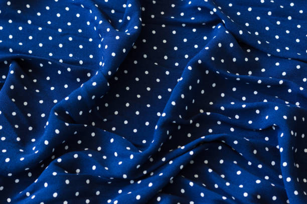 istock Navy blue creased fabric with white dots 1054004146