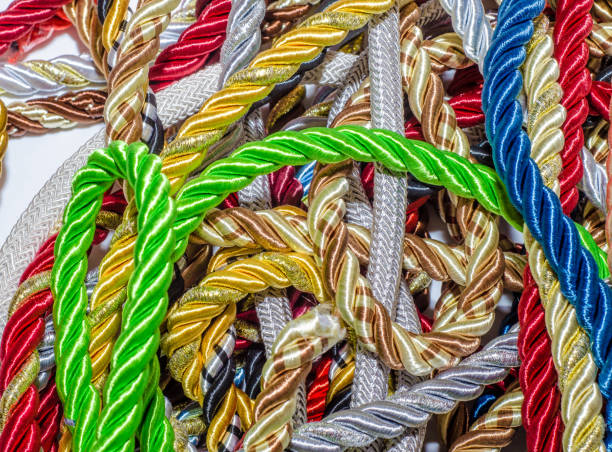 istock Multi-colored decorative rope scattered in a mess. Textile manufacture, threads, decor. 1054008418