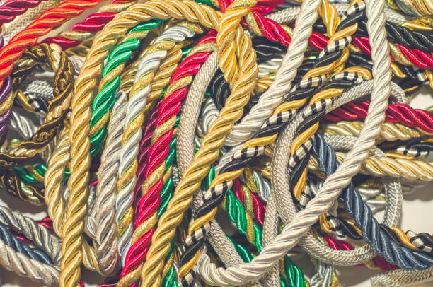 istock Multicolored thick ropes, chaos. Textile manufactory, home decoration, holiday. 1054008596