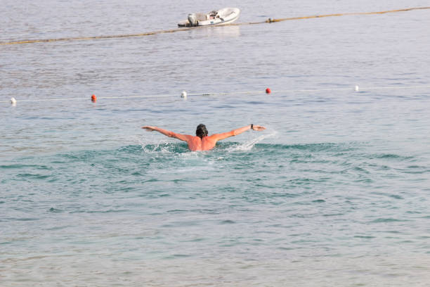 istock Trail swimmer on the sea surface. Background 1054009234