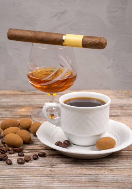 istock Black coffie and glass with brandy served with grape and chocolate 1054009370