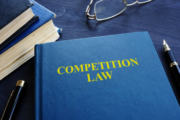 istock Competition law and pen on a table. 1054012116