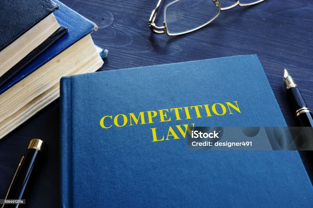 Competition law and pen on a table. Law Stock Photo