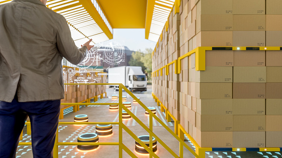 Automated robot carriers in modern distribution warehouse.