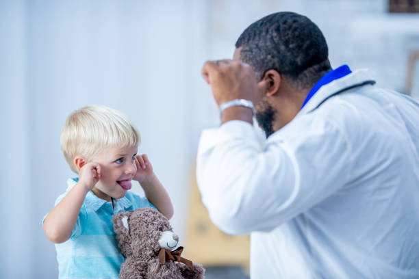 istock Doctor and patient being silly together 1054016608
