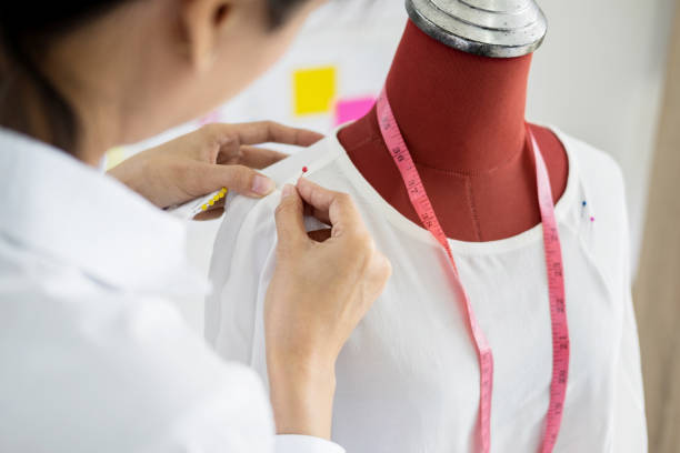 istock Close-Up Of Woman Working On Cloth 1054018190