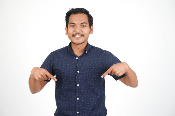 istock Young Asian Man Finger and Hand Pointing For 1054026078