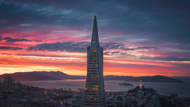 Transamerica Pyramid and San Francisco Skyline at Sunset SAN FRANCISCO, CA/USA - SEPT 14, 2018: The Transamerica Pyramid and San Francisco Skyline with Dramatic Clouds at Sunset transamerica pyramid san francisco stock pictures, royalty-free photos & images