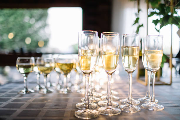 istock Festive table setting with champagne. champagne glasses close up. 1054032106