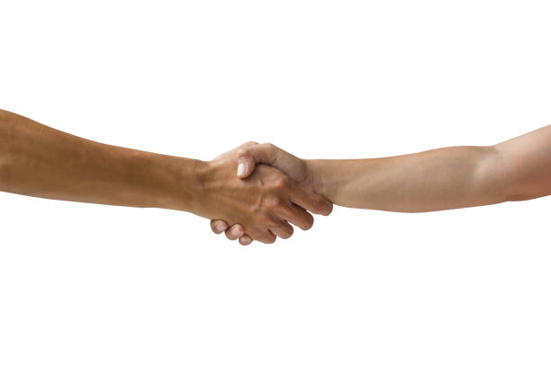 Friend's greetings. Teamwork and communications. Two male hands shaking isolated on grey studio background. Concept of help, partnership, friendship, relation, business, togetherness.