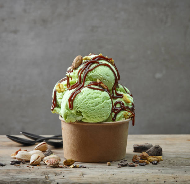 istock paper cup of pistachio ice cream 1054032342
