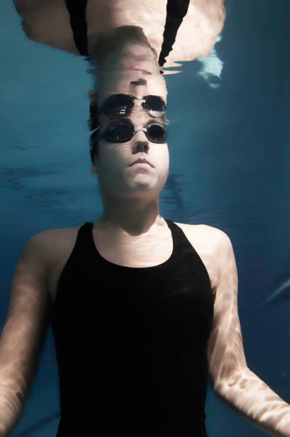 istock Young Woman Swimming In Pool 1054033002
