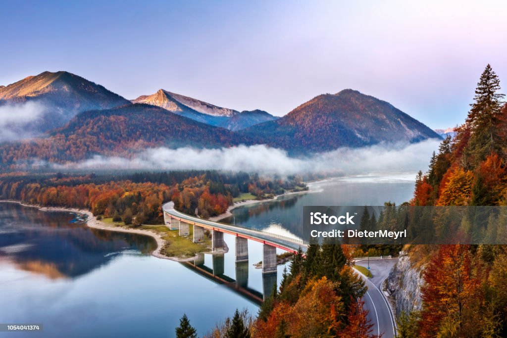 Lake sylvester - Sylvensteinspeicher at Autmun, Sylvensteinsee, Bavaria, Germany Autumn, Bavaria, Bridge - Built Structure, European Alps, Fog Bridge - Built Structure Stock Photo