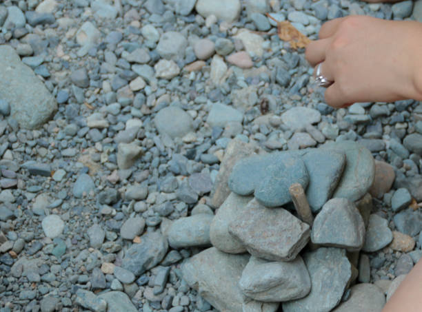 istock Mother and Child Building with Rocks Together 1054048278