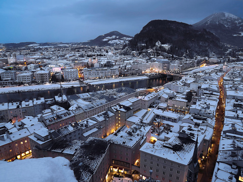Night in winter with lot of snow over Salzburg, city known as birthplace of Mozart in Austria