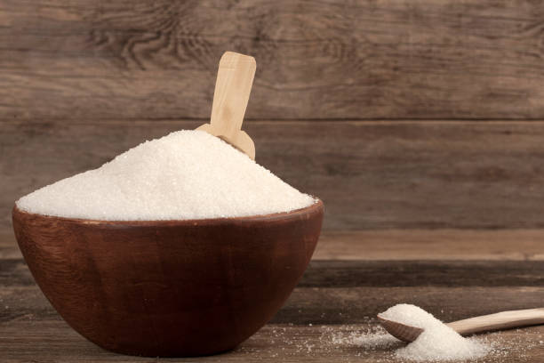 istock white sugar bowl over wooden table 1054051186