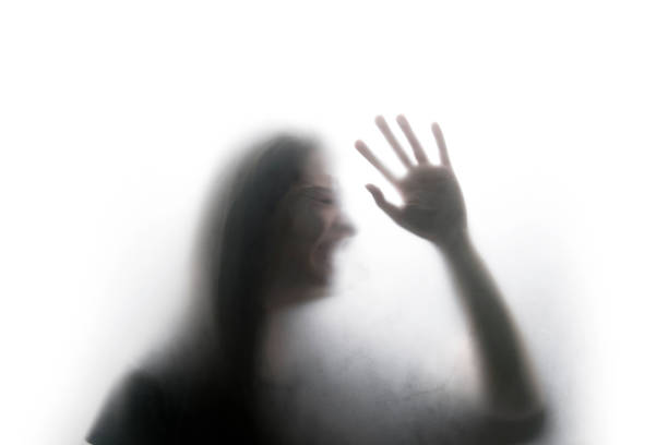 istock Person shadows on Frosted glass 1054061588