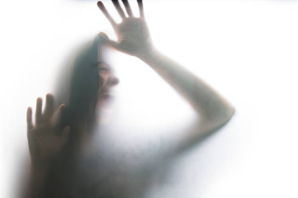 Person shadows on Frosted glass