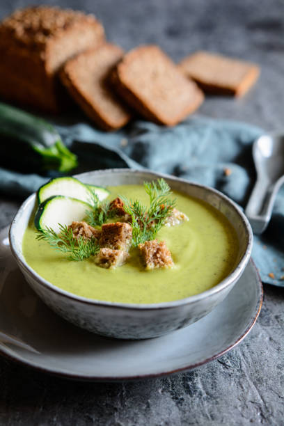 istock Creamy zucchini soup with croutons 1054080168