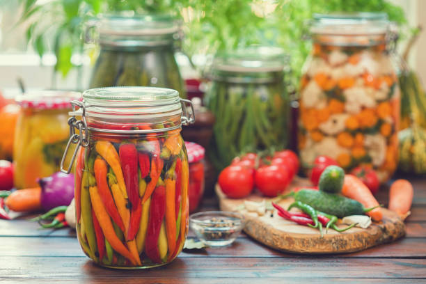 Preserving fresh organic chili peppers in jars at home