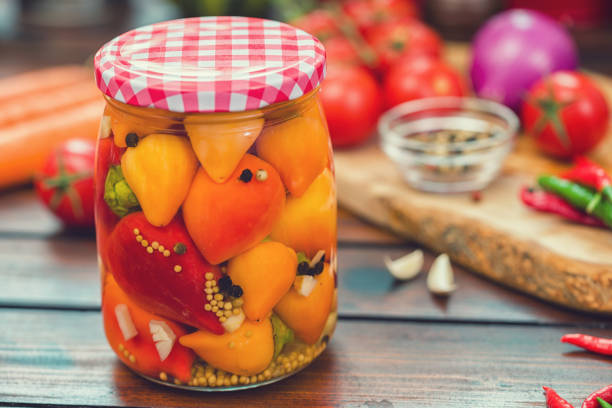 Preserving fresh organic chili peppers in jars at home