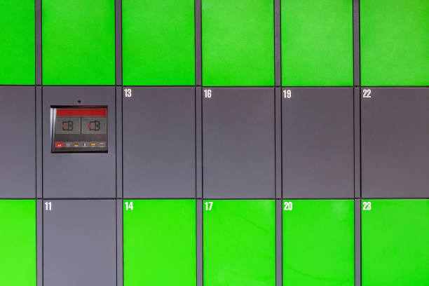 istock Outdoor green automated public lockers with touchscreen display. Autonomous post parcel terminal.Self-service street cloackroom cell machine 1054084620