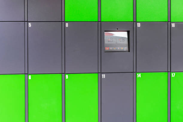 istock Outdoor green automated public lockers with touchscreen display. Autonomous post parcel terminal.Self-service street cloackroom cell machine 1054084628