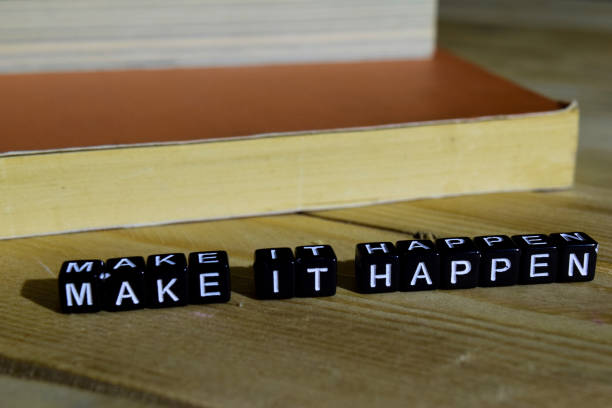 istock Make it happen on wooden blocks. 1054085924