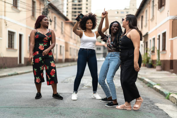 istock Group of diverse friends dancing at street 1054087162