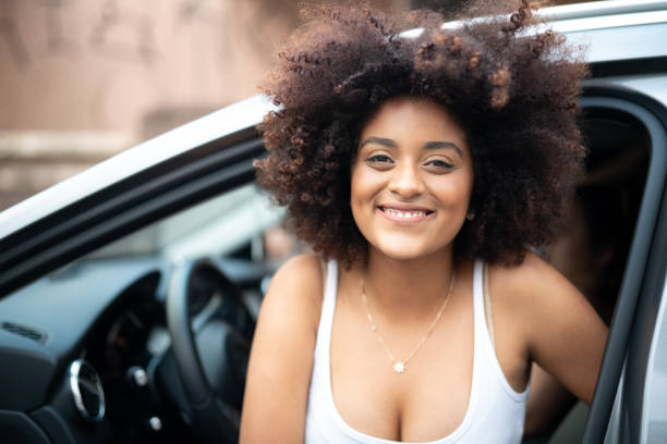 istock Woman Driver Portrait at Car Interior - Pride 1054091430