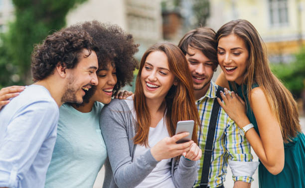 istock Multi-ethnic group of friends with smart phone 1054092768