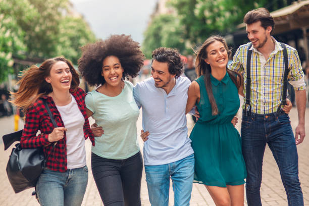 istock Happy friends on the street 1054092784